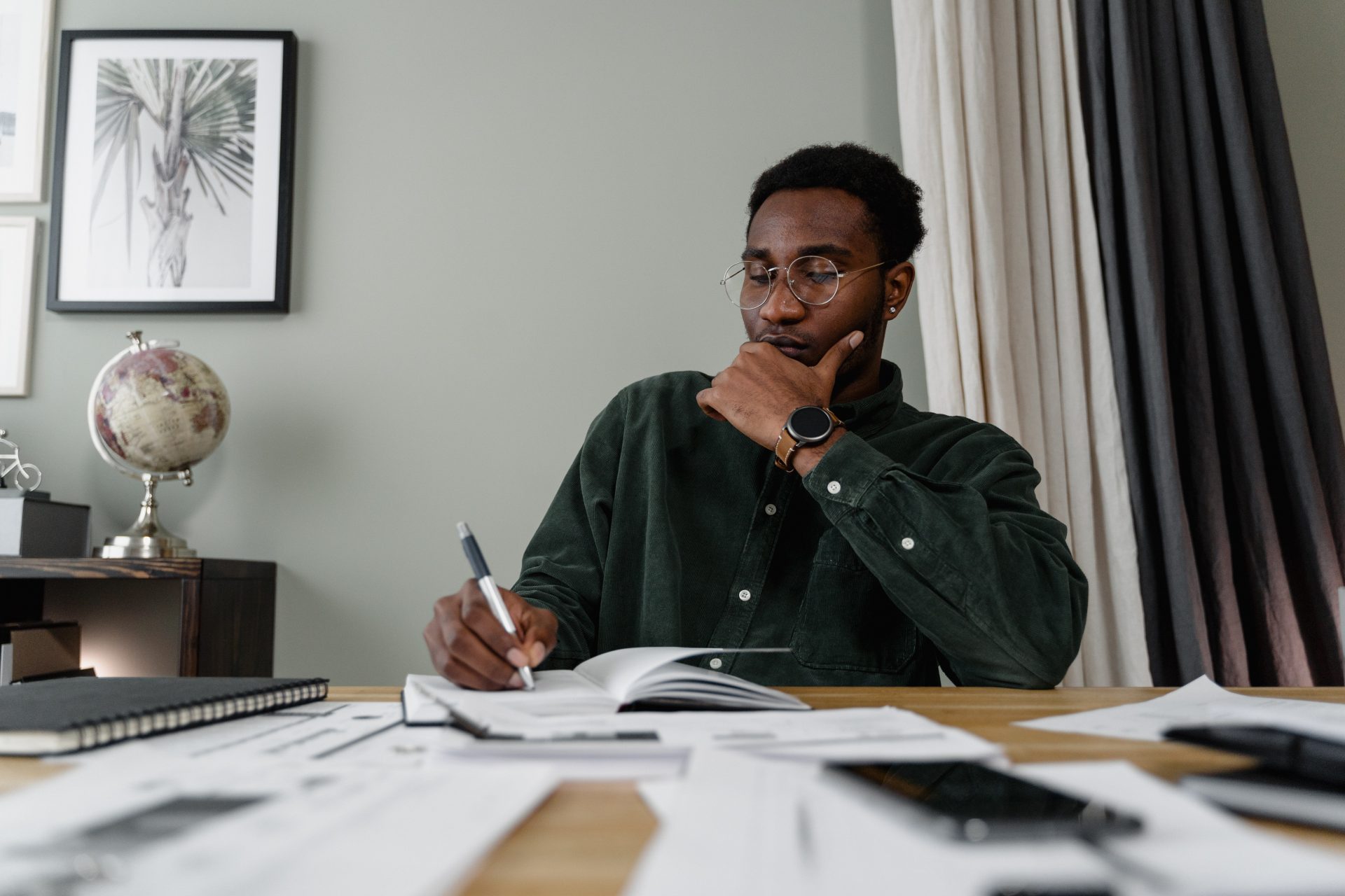 black guy working on budgeting